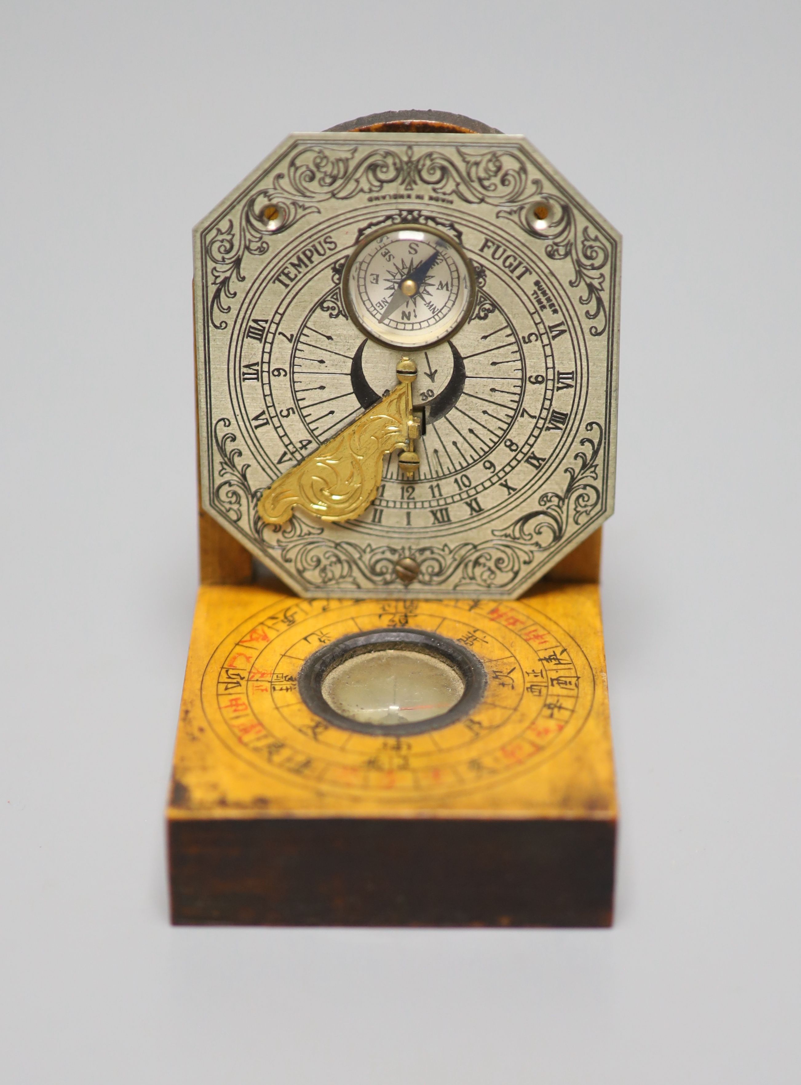 A reproduction Butterfield style scale and a Chinese compass/sundial, longest 12cm